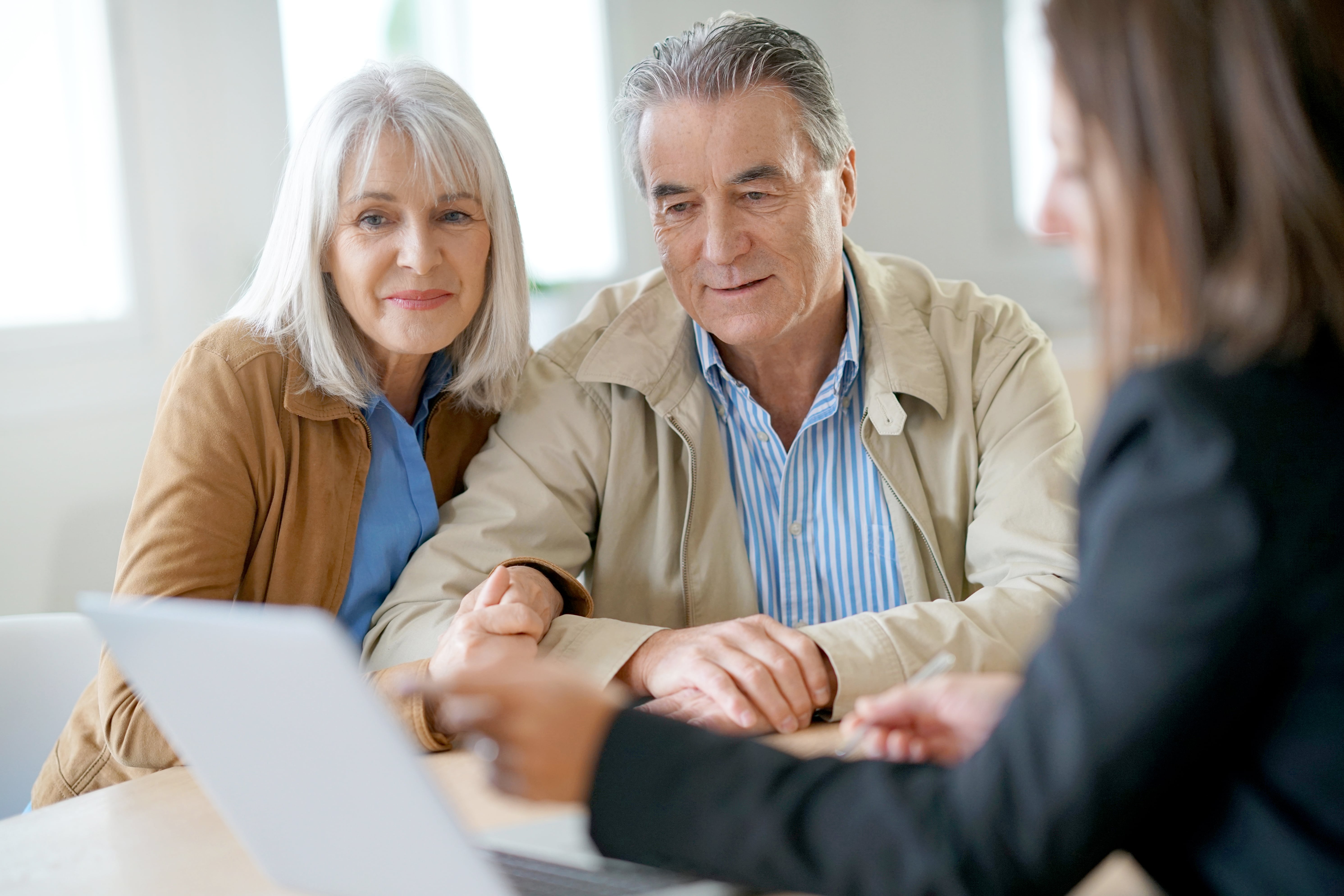 couple sitting with lawyer planning their estate